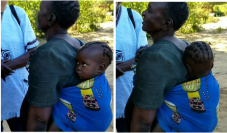 A young child shyly turns away when greeted