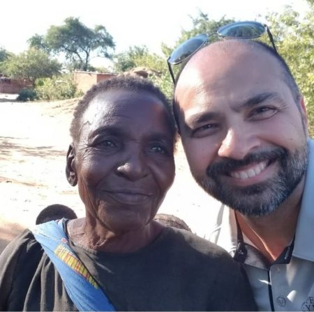 Operation Eyesight's Presidnet with a woman who received sight-restoring eye surgery thanks to our donors