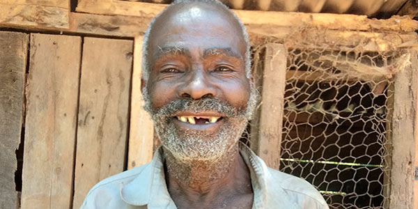 Portrait of Simon. A senior man smiling at the camera