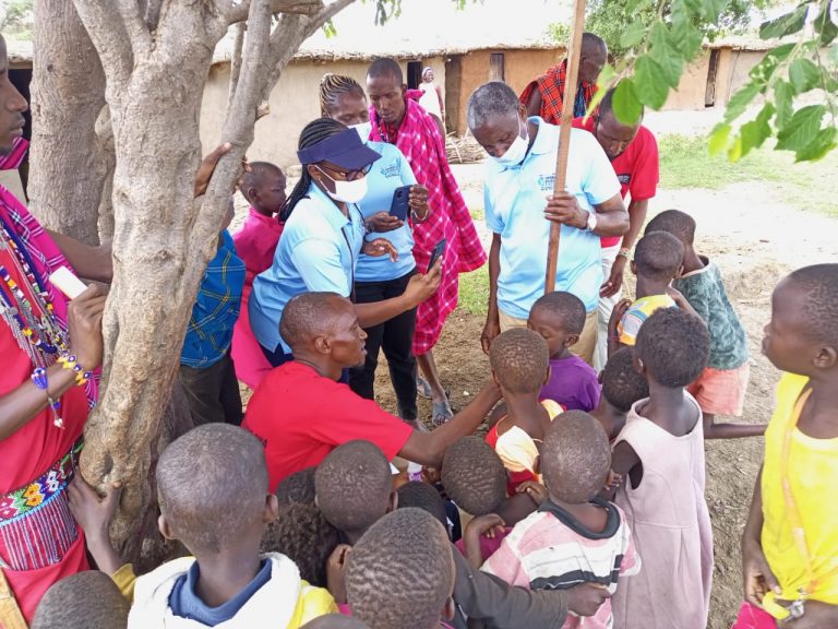 Operation Eyesight staff measures the height of children as a part of administering antibiotics to prevent trachoma