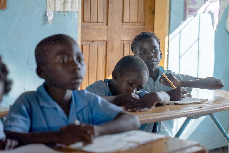 Students in their classroom takes notes