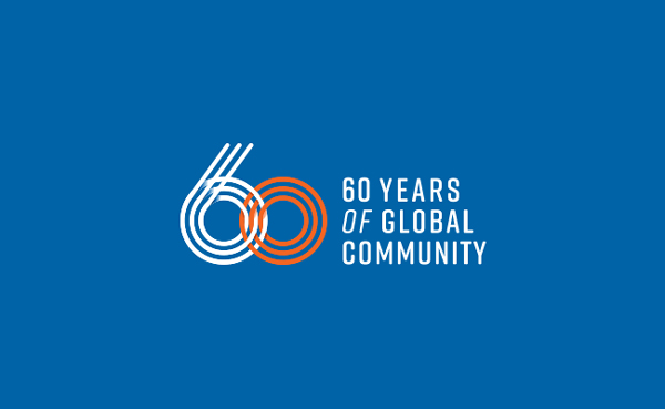 "60 years of global community" written on a blue background